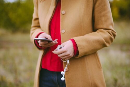 A person looking up information on their phone on how to conceive fast.