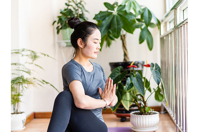 A woman doing yoga.