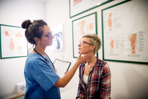 A healthcare provider examining a patient.