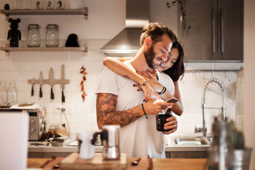 A couple in the kitchen about to have the fertility talk.