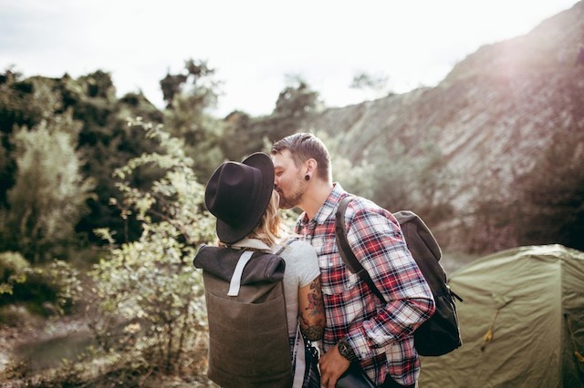 Two people kissing.