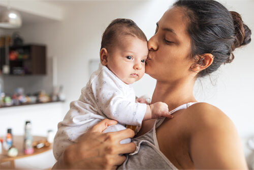 women holding newborn