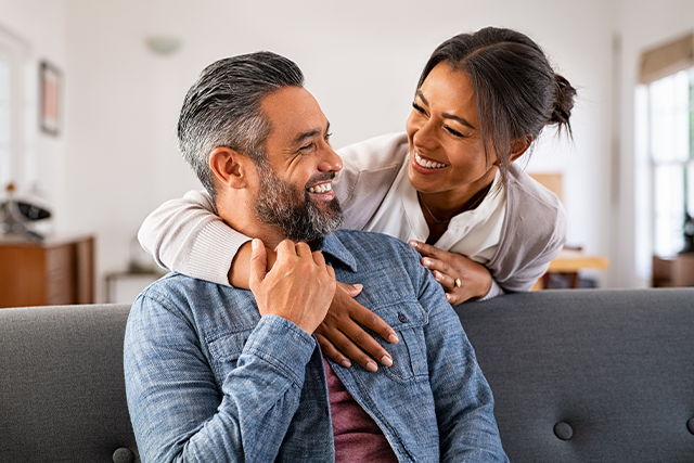 man and woman laugh together