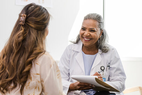 person speaking with health provider