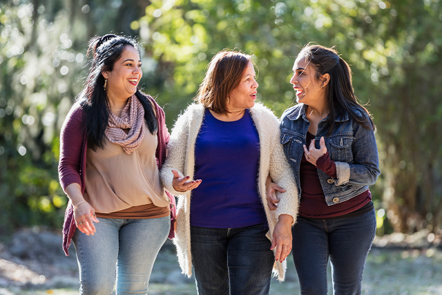 woman walking with her two adult daughters
