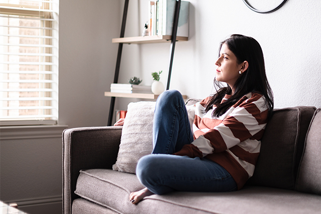 Woman sitting on couch