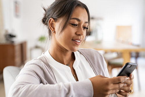 woman looks at phone