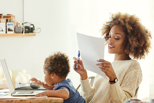 Mom working with child on her lap