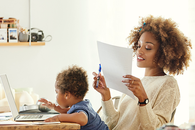 Mom working with child on her lap