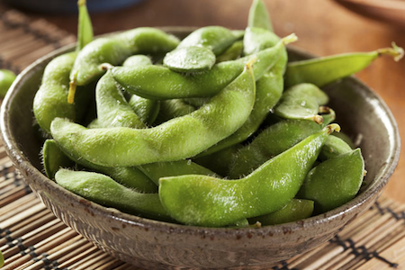 brown bowl of edamame or soy beans