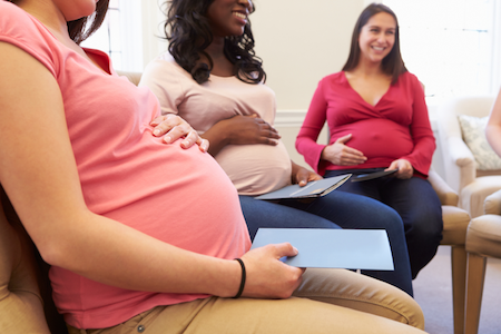 pregnant women sitting in a circle at childbirth class