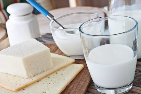 cups of milk and a block of cheese