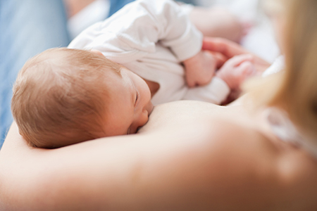 mother breastfeeding baby