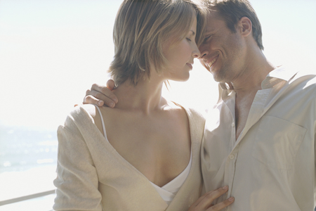 A happy couple holding each other lovingly to represent getting pregnant after 35.