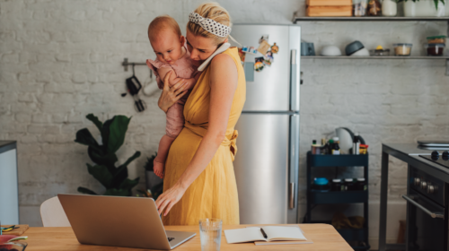 Woman who is working with baby on hip